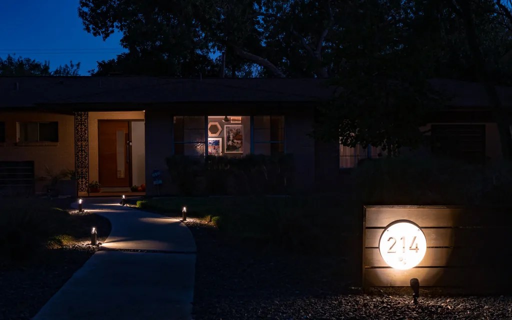 Low-voltage path lights along a front walkway at night